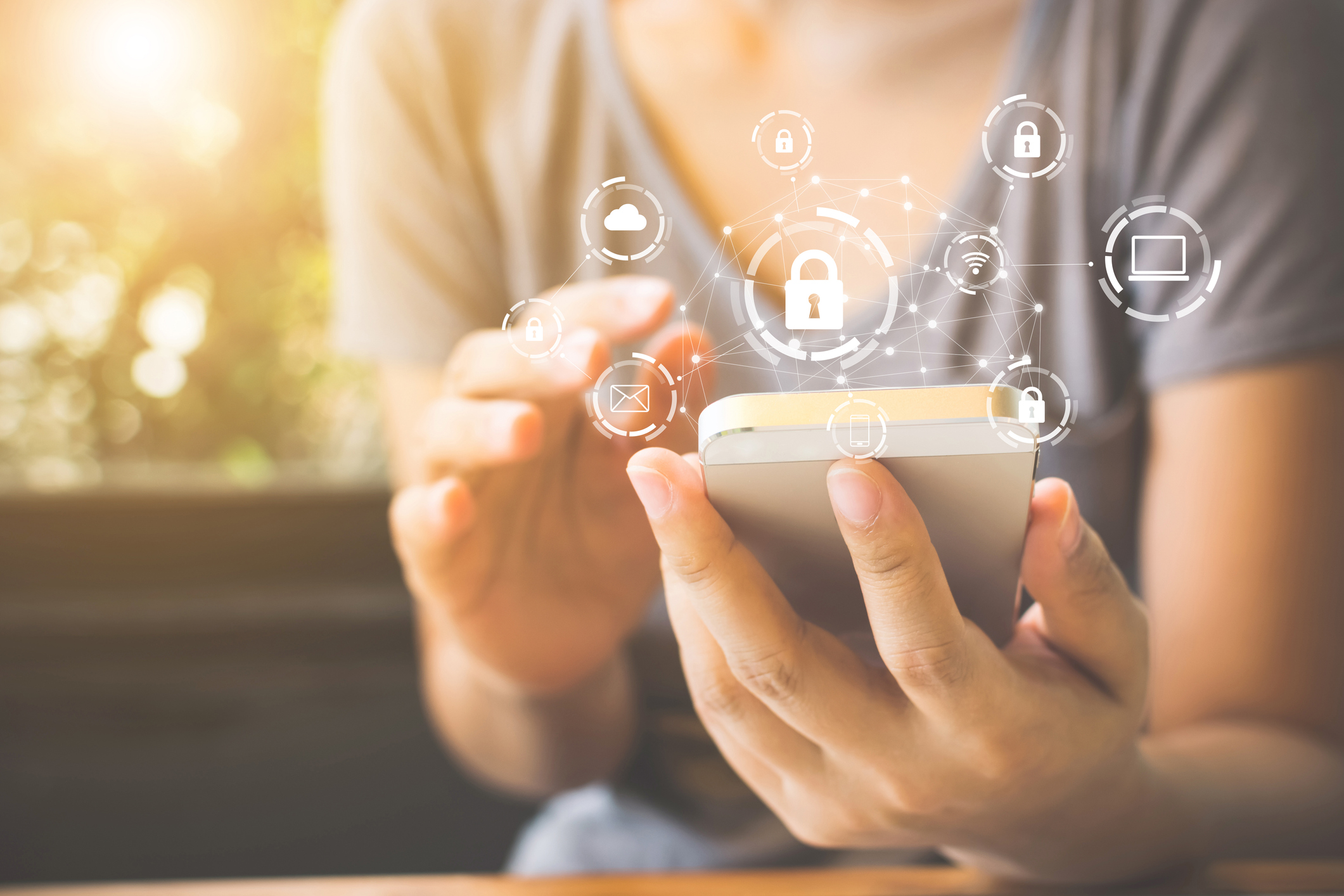 A woman using a phone with a graphic of a padlock and other phone features