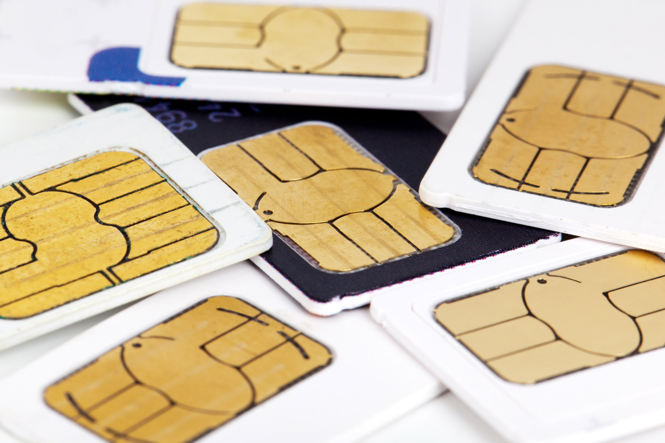 A pile of sim cards on a white background